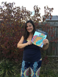 Gaby Merediz wears palazzo pants the day her coloring journal is published